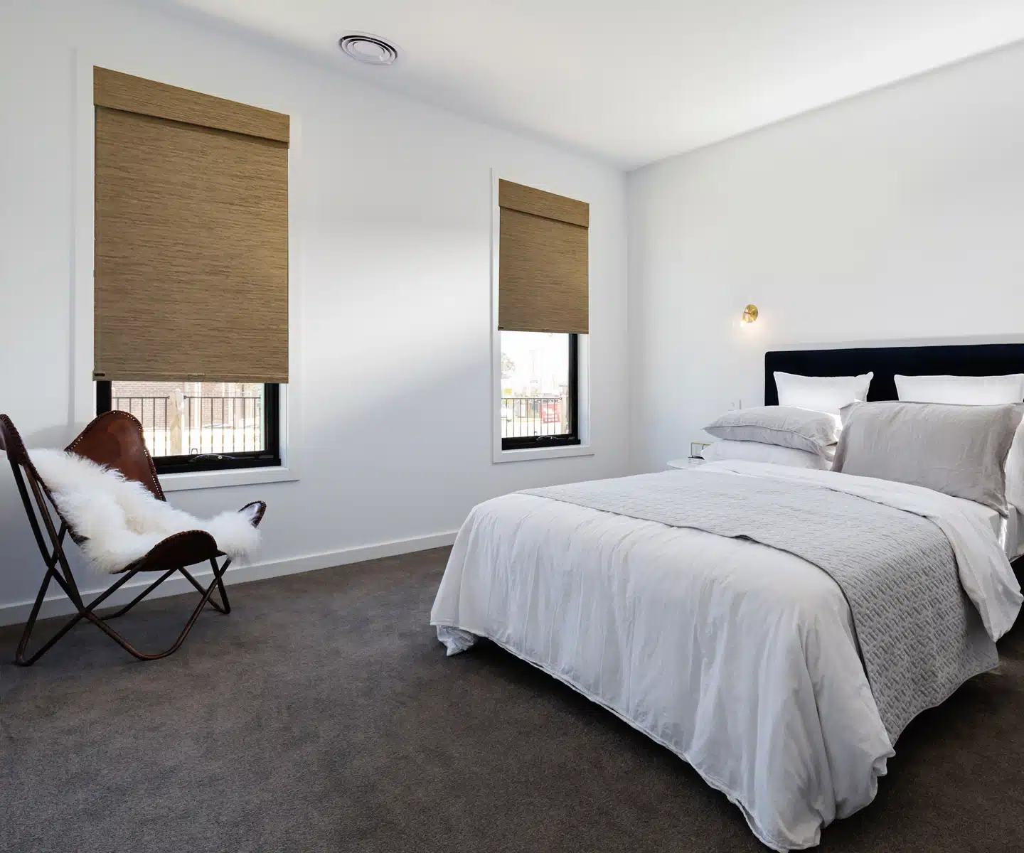 Near Bethesda, MD, sleek and sophisticated, Soluna Roller Shades in a modern bedroom