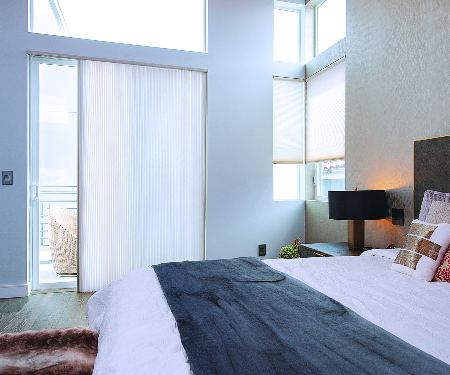 In McLean, VA, a cozy bedroom with bright, honeycomb shades with Sound Absorption Capabilities